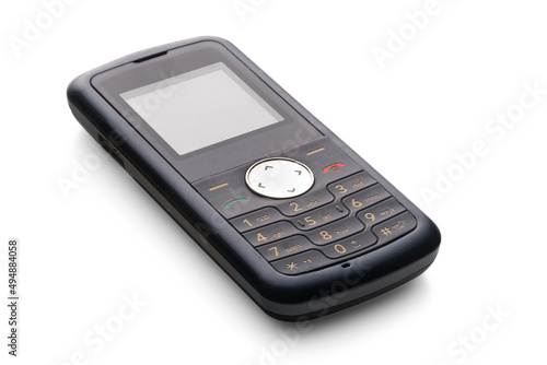 Old push-button mobile phone isolated on a white background
