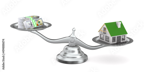 house and money on scale. I...