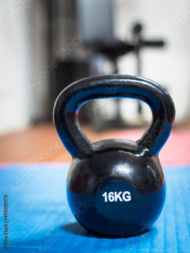 Fototapeta Naklejka Na Ścianę i Meble -  16 kg kettlebell at a gym. Weight lifting concept.
