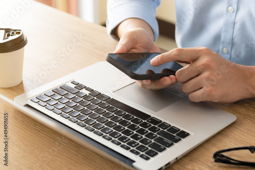 businessman working using mobile phones and laptop computers Liaise with customers and plan business strategies, working concepts using technology in the most efficient way.