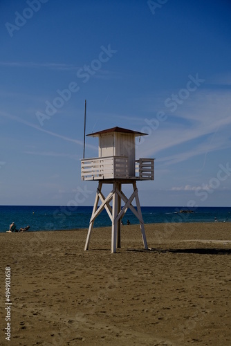 Lifeguard post under a blue sky on the beach © Distortion Media