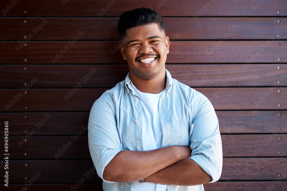 Positivity is best paired with ambition. Portrait of a confident young businessman working in a modern office. Positivity is best paired with ambition. Portrait of a confident young businessman working in a modern office.