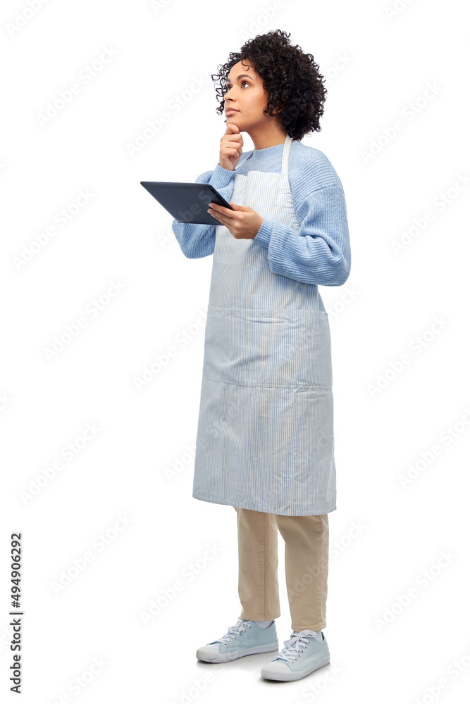 cooking, culinary and people concept - thinking woman in apron with tablet pc computer over white background cooking, culinary and people concept - thinking woman in apron with tablet pc computer over white background