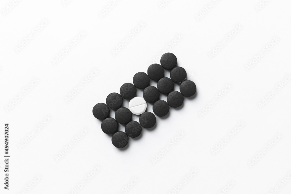 Different pills on white background. Concept of uniqueness Different pills on white background. Concept of uniqueness