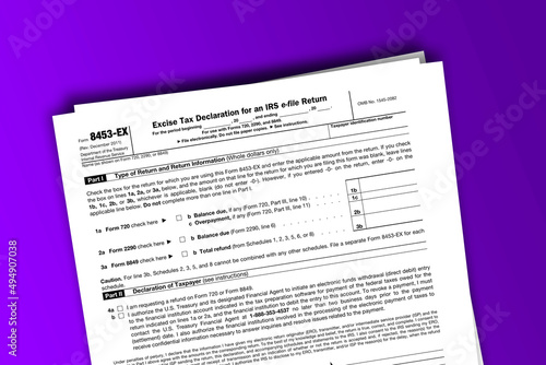 Form 8453-EX documentation published IRS USA 07.17.2012. American tax document on colored © dmitriy