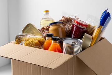 charity, support and concept - close up of food in donation box