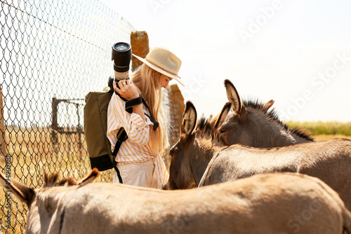 Female tourist with donkeys...