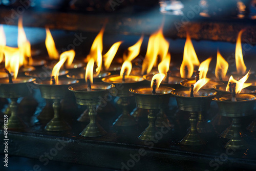 Buddhist traditional sangha in Buddhist Datsan. Sacred place with candles photo