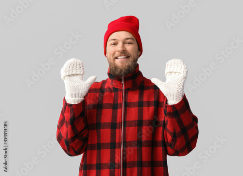 Young bearded man in warm g...