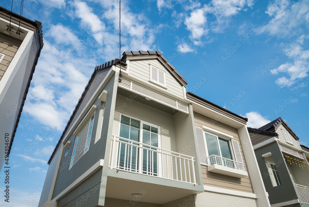 New house for sale with blue sky background. Real estate property, home loan and banking concept. New house for sale with blue sky background. Real estate property, home loan and banking concept.
