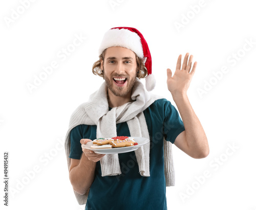 Young man in Santa hat hold...