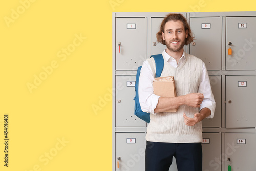 Male student with books nea...
