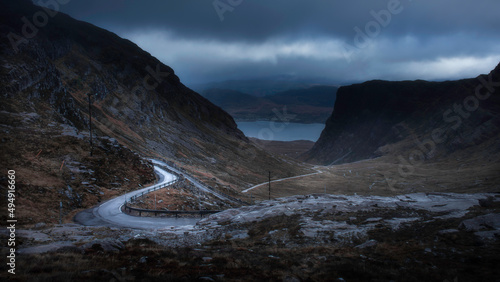 Moody sky over Applecross pass in Scotland. Beautiful view on NC500 road trip. Dark and moody landscape scenery.