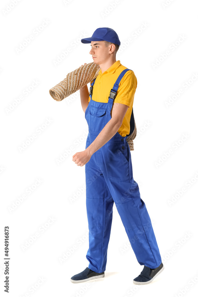 Male worker with rolled carpet on white background Male worker with rolled carpet on white background
