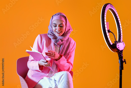 Muslim female blogger with ...