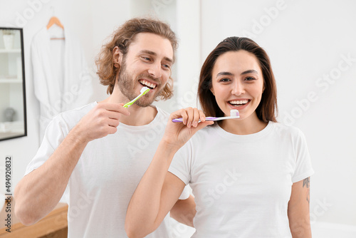 Lovely young couple brushin...