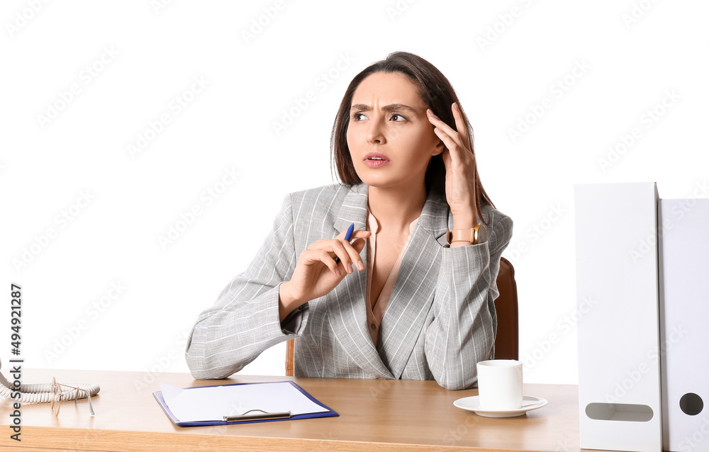 Young secretary at table on white background Young secretary at table on white background