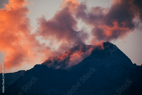 pink sunset clouds over the mountains