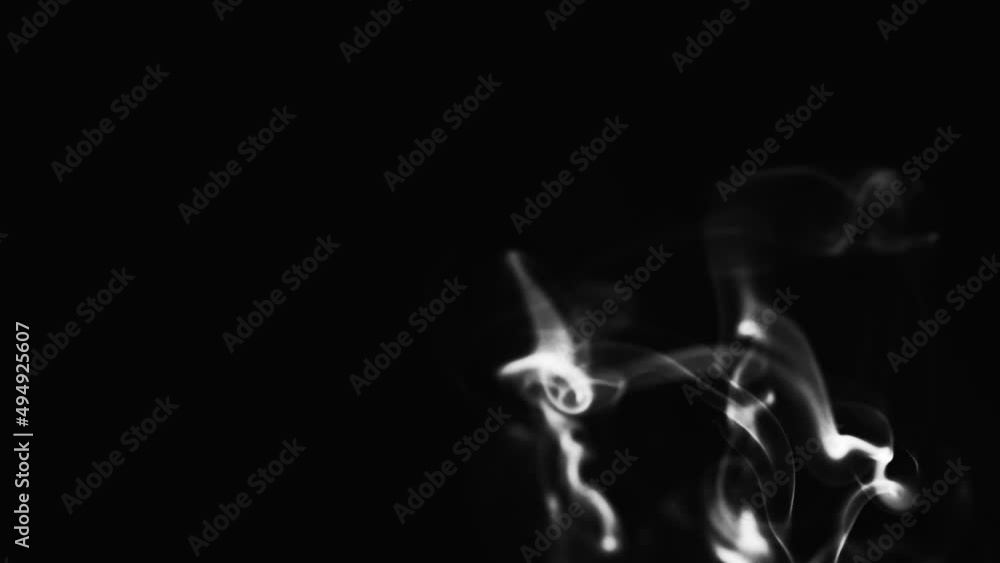 Abstract blue color smoke with a black background in slow motion. Realistic cloud smoke with streamline pattern. Abstract blue color smoke with a black background in slow motion. Realistic cloud smoke with streamline pattern.