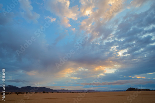 Yellow and blue clouds at sunset in the Namib Desert