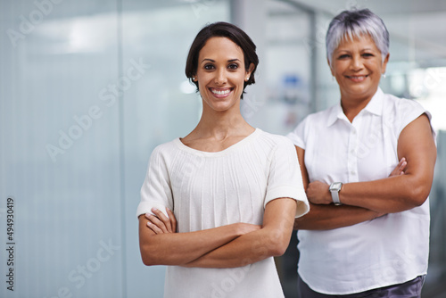 Confident in our capabilities. Portrait of two businesswomen posing in their office together.