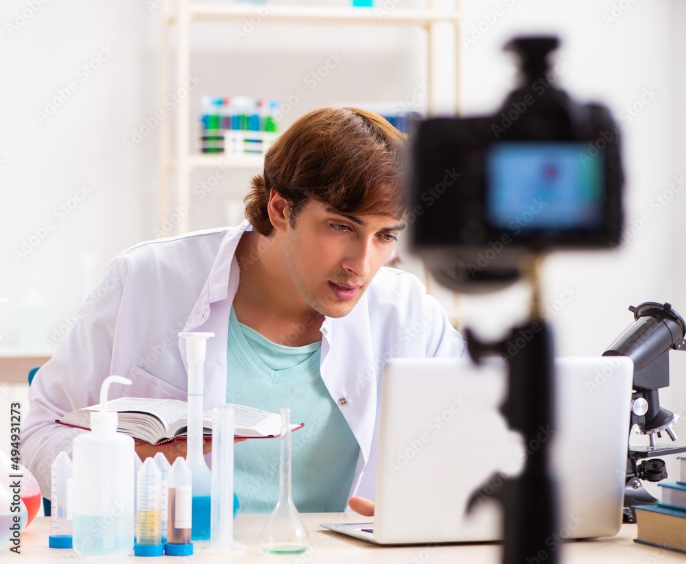 Chemist blogger recording video for his blog Chemist blogger recording video for his blog