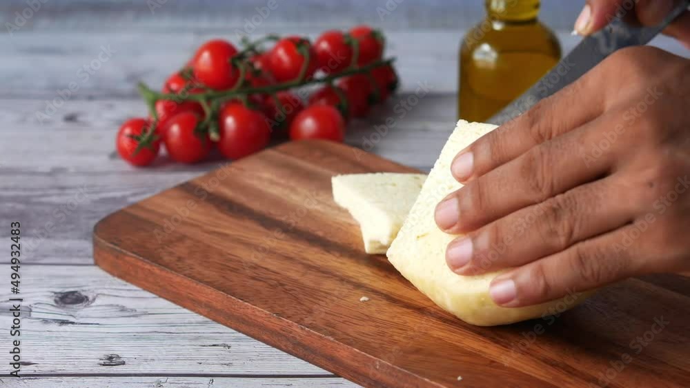 close up of men cutting fresh cheese on table close up of men cutting fresh cheese on table
