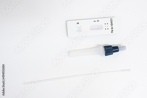 COVID-19, Antigen test kit (ATK) with a nasal swab on white background.Rapid antigen test kit for self test at home.