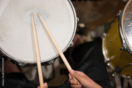Drum set with drumstic on stage.Musician playing drum during a live performance.