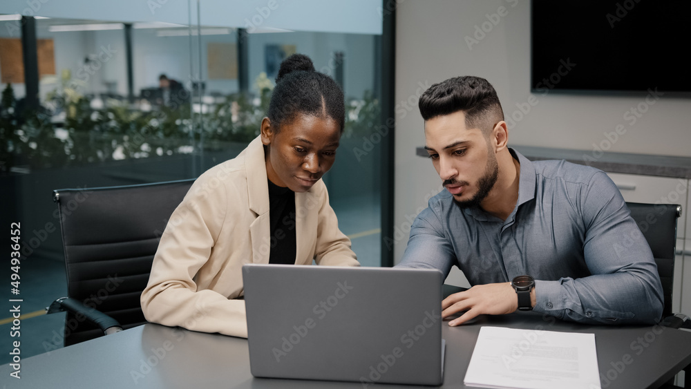 African female financial advisor businesswoman agent lawyer insurer colleague partner discuss project papers documents report with arab indian male explaining contract negotiating agreement consulting African female financial advisor businesswoman agent lawyer insurer colleague partner discuss project papers documents report with arab indian male explaining contract negotiating agreement consulting