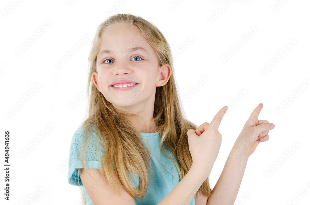 Photo of happy little girl standing isolated over white wall background. Adorable little girl showing back copyspace pointing Photo of happy little girl standing isolated over white wall background. Adorable little girl showing back copyspace pointing