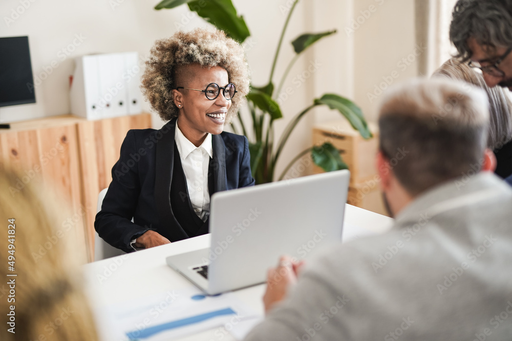 Happy multiracial business people working inside modern office using computer laptop Happy multiracial business people working inside modern office using computer laptop
