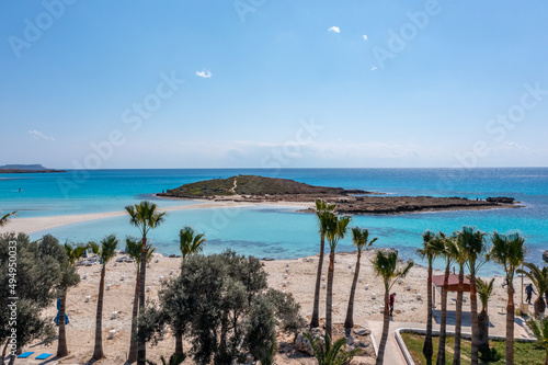 Nissi Beach in Ayia Napa, clean aerial photo of famous tourist beach in Cyprus, the place is a known destination on island and is formed from a smaller island just near the main shore