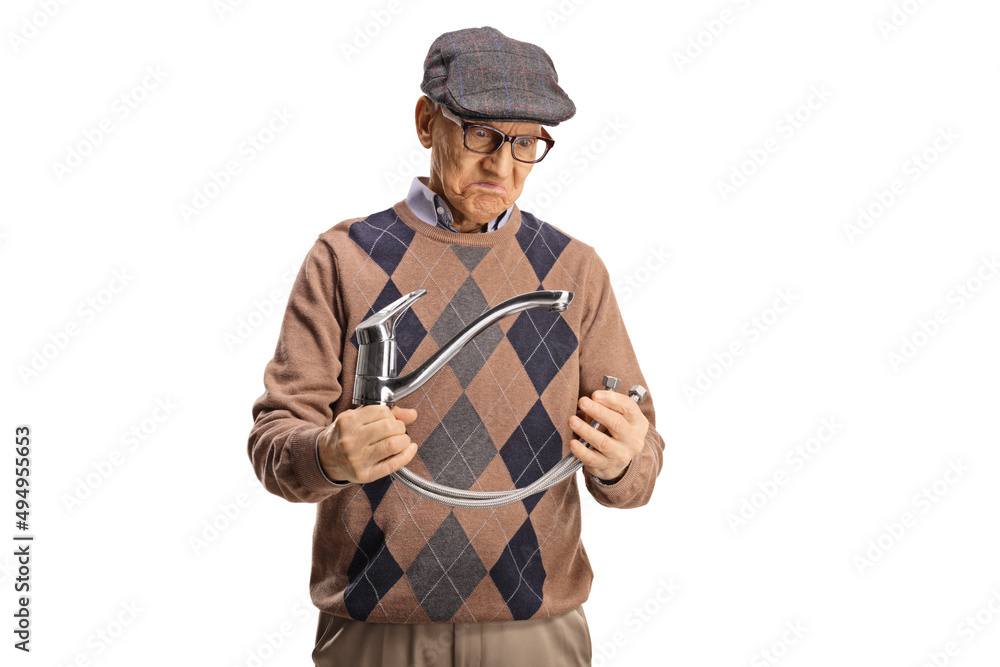 Elderly man holding a steel hose with water tap Elderly man holding a steel hose with water tap