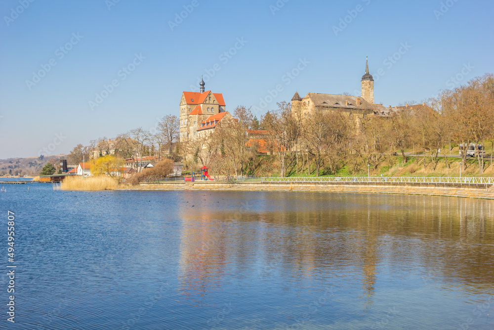 Blue lake in front of the historic castle in Seeburg, Germany