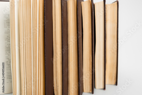 close up view of several paper books on grey background.