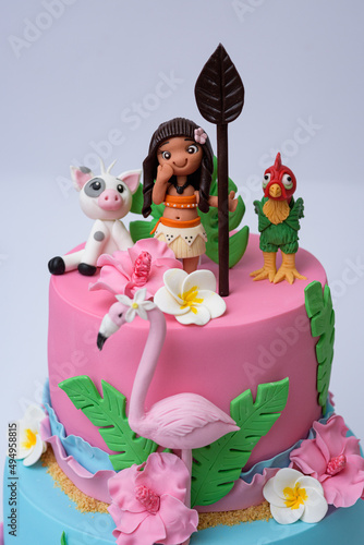 фотографія Vertical photo of Moana and flamingo theme layer cake