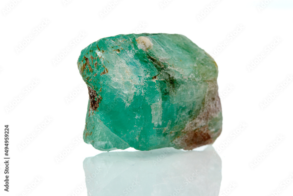 macro mineral stone emerald on a white background macro mineral stone emerald on a white background