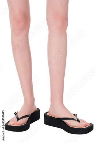 women shoes on legs on a white background
