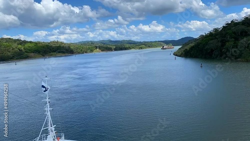 Panama Canal: Timelapse of Gatun Lake. The bow of Emerald Princess Cruise ship sails through man-made Gatun Lake in the middle of the Panama Canal. It was formed by damming the Chagres River.  photo