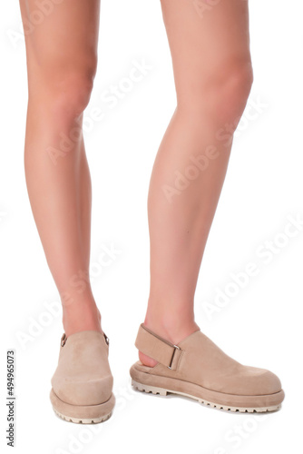 women shoes on legs on a white background