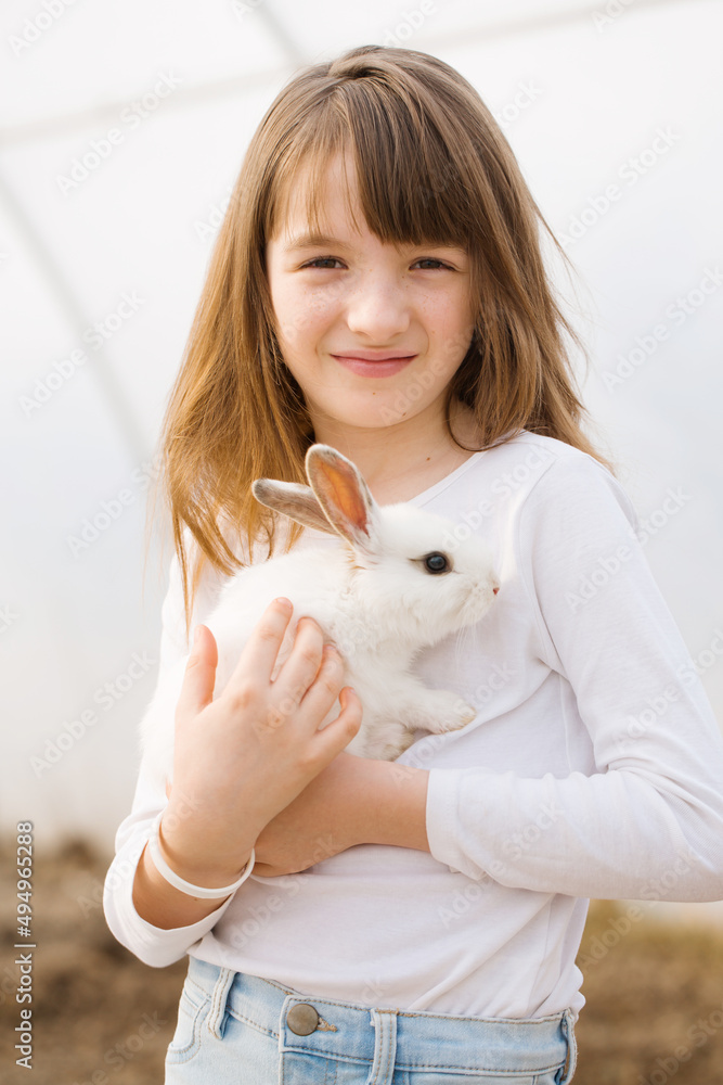 Happy girl with rabbit