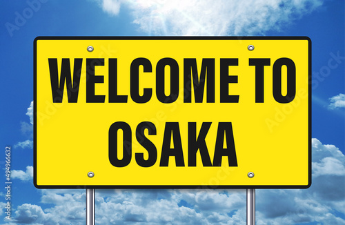 welcome to Osaka written on road sign