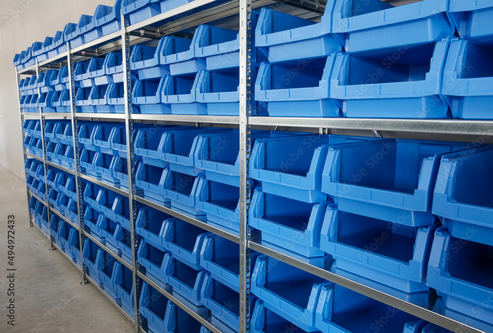 Tool Storage Box and Tool Chests Protective cases for tools and devices. blue plastic Storage boxes on Shelf for accessories or tools set in home office or garage