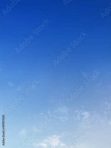 Blue sky with white fluffy cirrus clouds, soft focus. Concept of freedom, relaxation, ecology. Copy space. Empty space for your message.