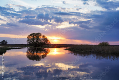 April sunset over water, early spring landscape over Biebrza photo