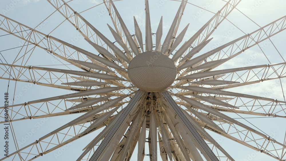 Naklejka premium Ferris wheel. Observation wheel. Sun symbol