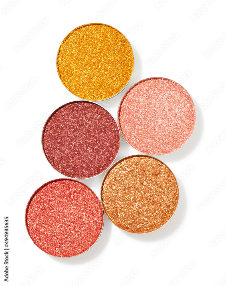Shimmer warm tones eye shadow refills isolated on white background Shimmer warm tones eye shadow refills isolated on white background