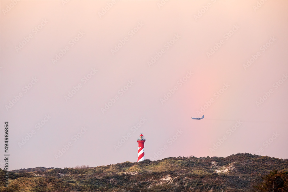 Fototapeta premium Plain above lighthouse in Holland