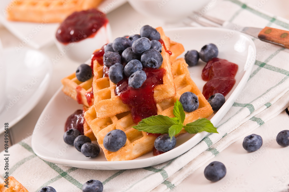 Waffles with blueberries and jam. Waffles with blueberries and jam.